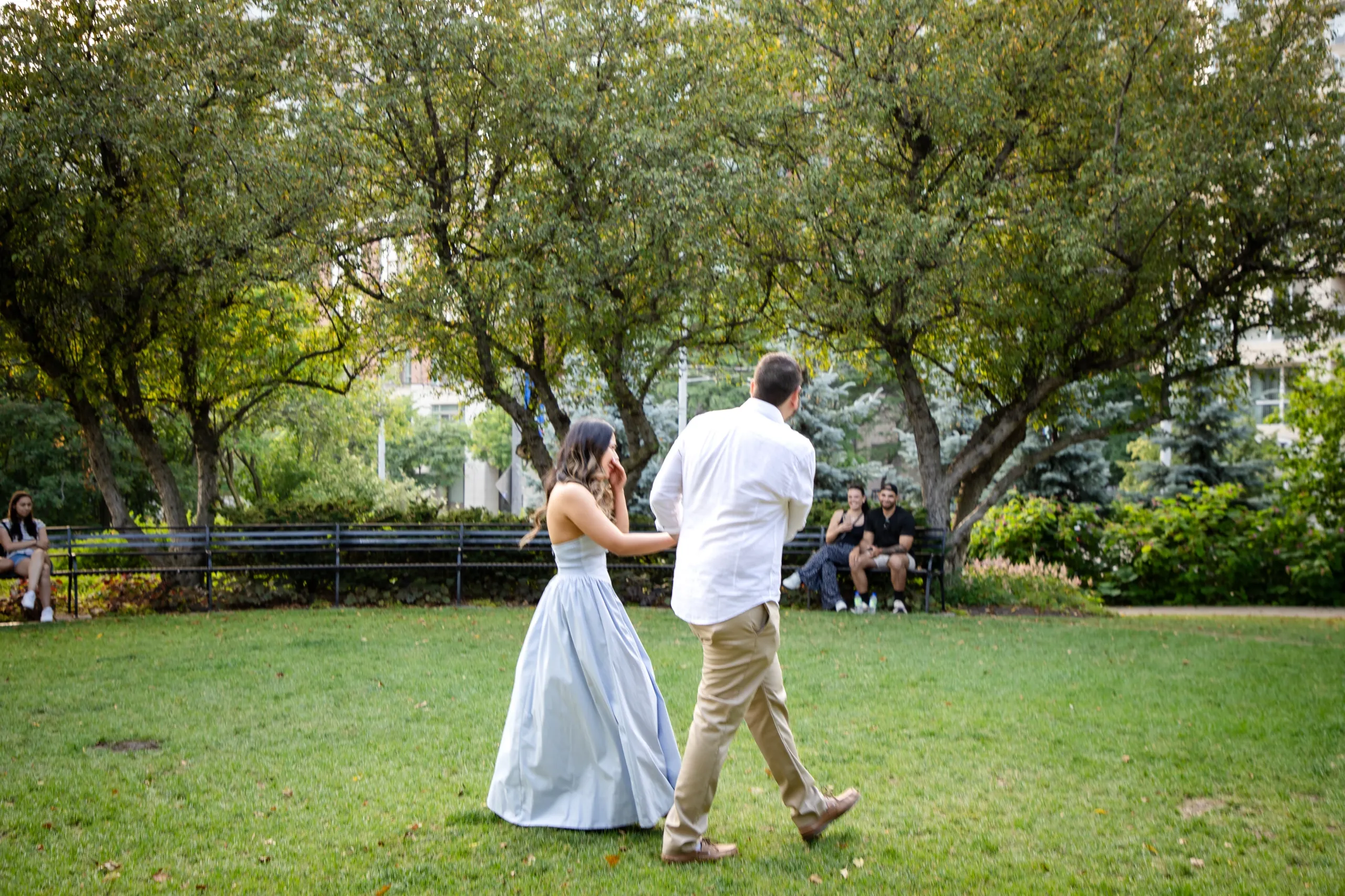 Margarita walking toward the Toronto Music Garden amphitheatre moments before the proposal, by AD Photography