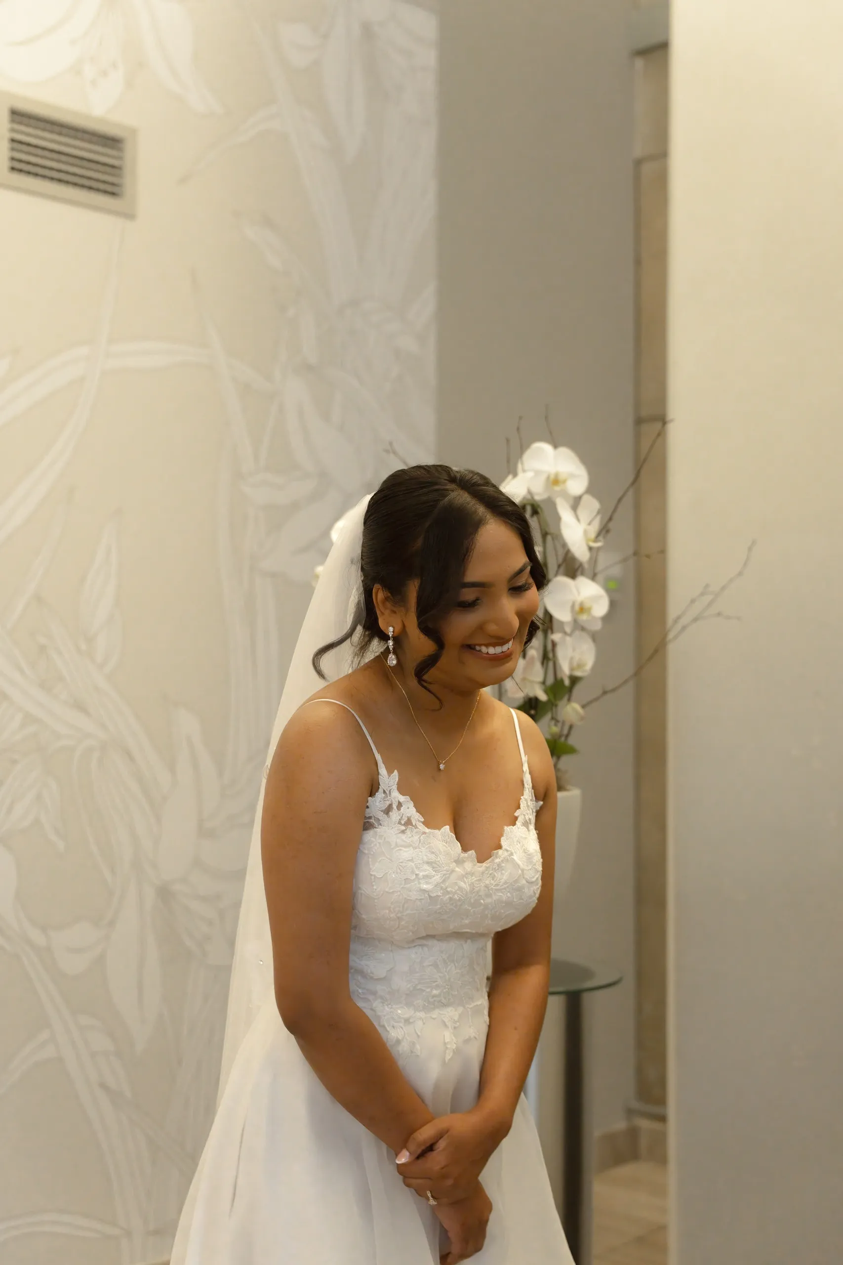 Bride laughs while her groom reads his vows at Toronto City Hall, by AD Photography