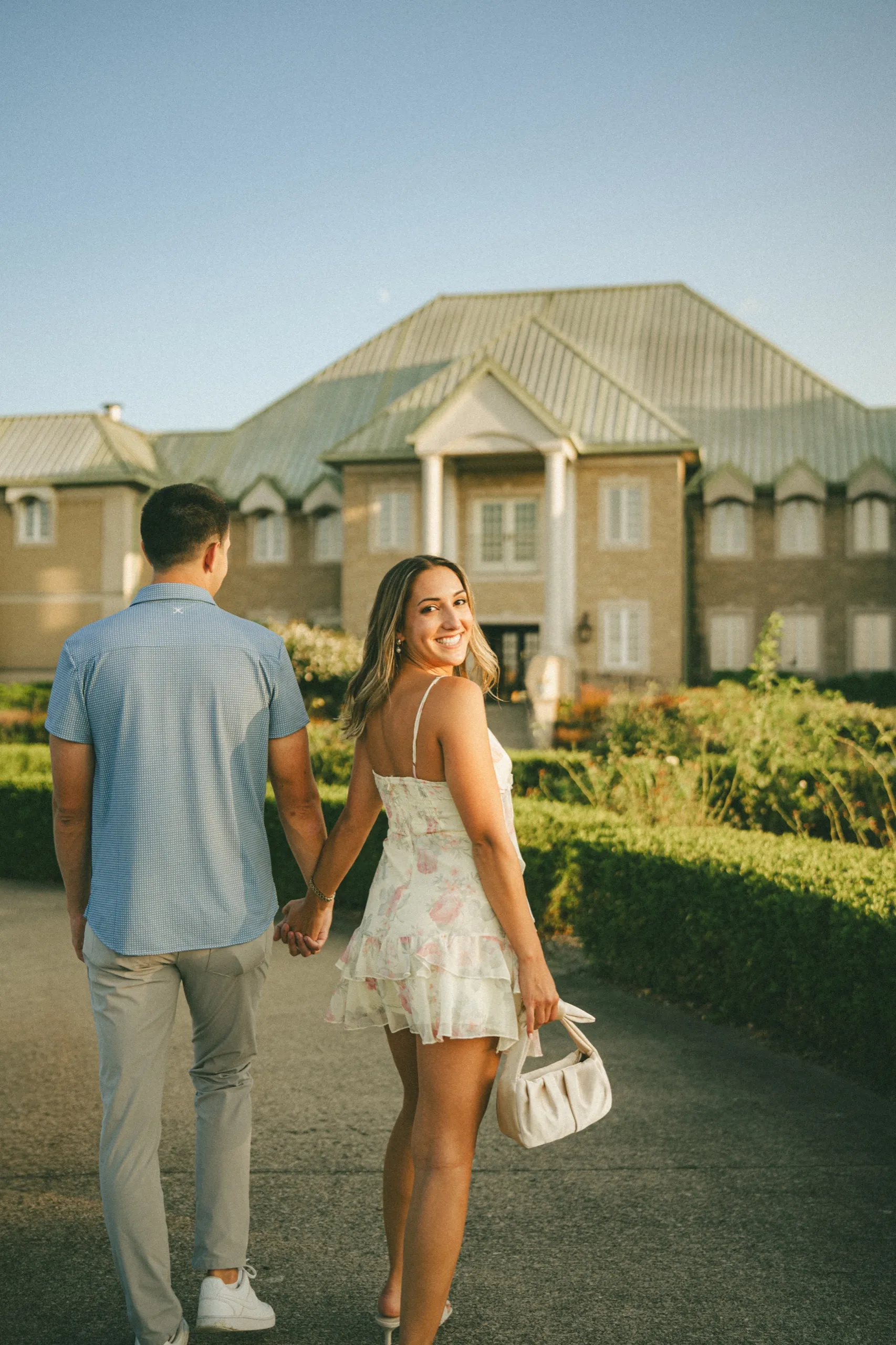 Ashley glancing back over her shoulder on the drive up to the Château des Charmes winery building, by AD Photography