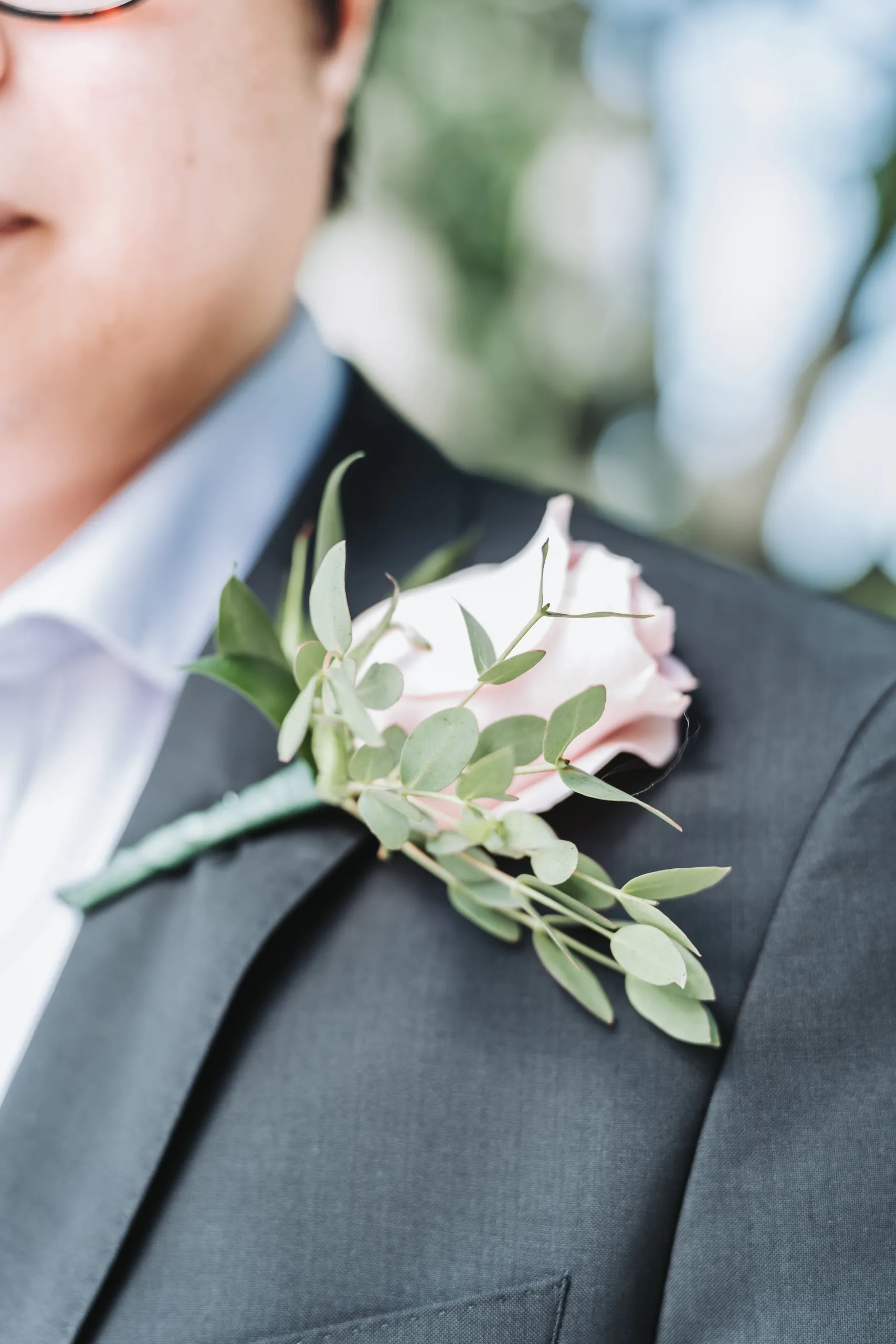 Close detail of the blush rose boutonniere on Micheal's lapel at the Niagara Parks Botanical Gardens, by AD Photography