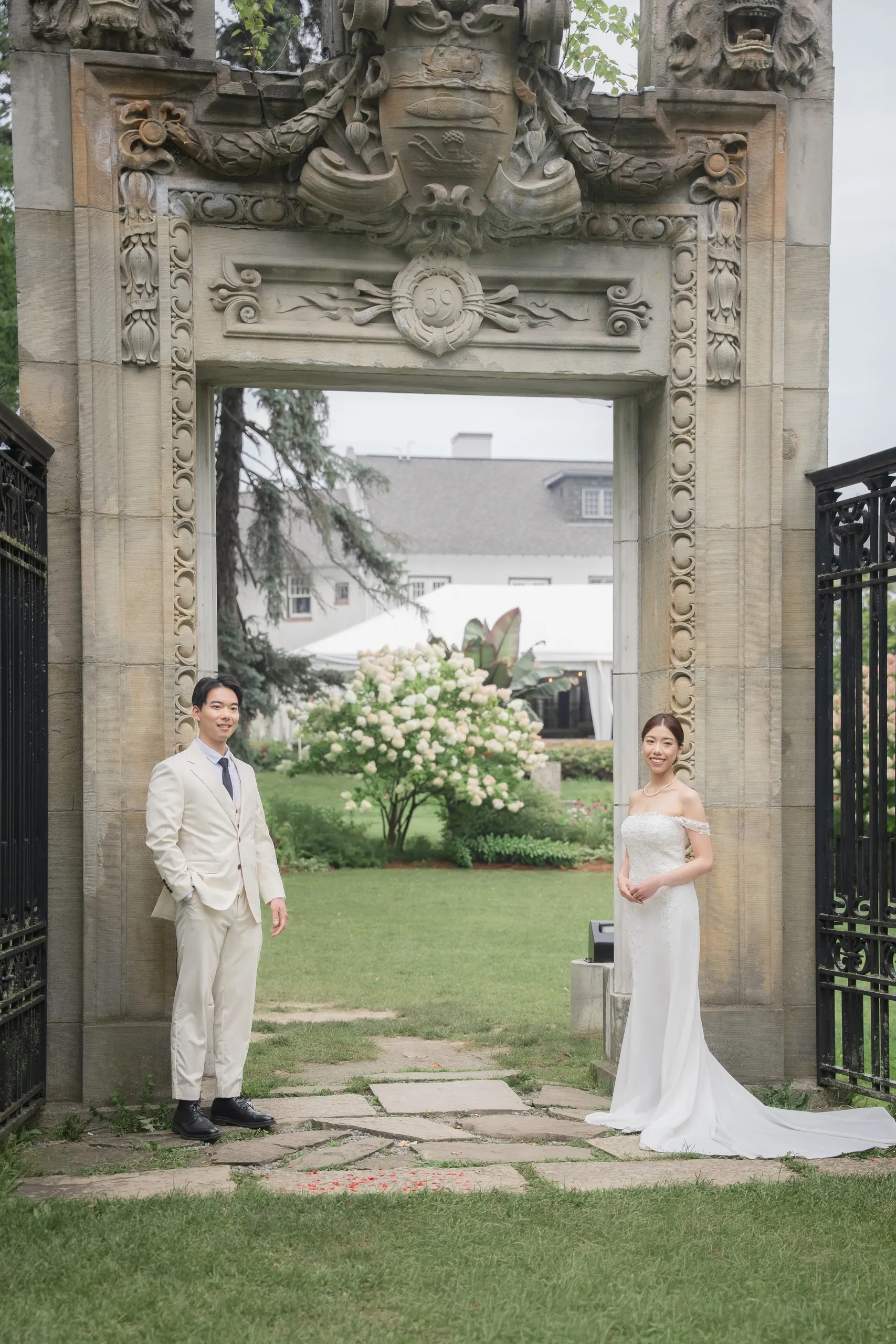 Josie and Nelson framed by the carved stone gateway at Guild Park, Scarborough, by AD Photography