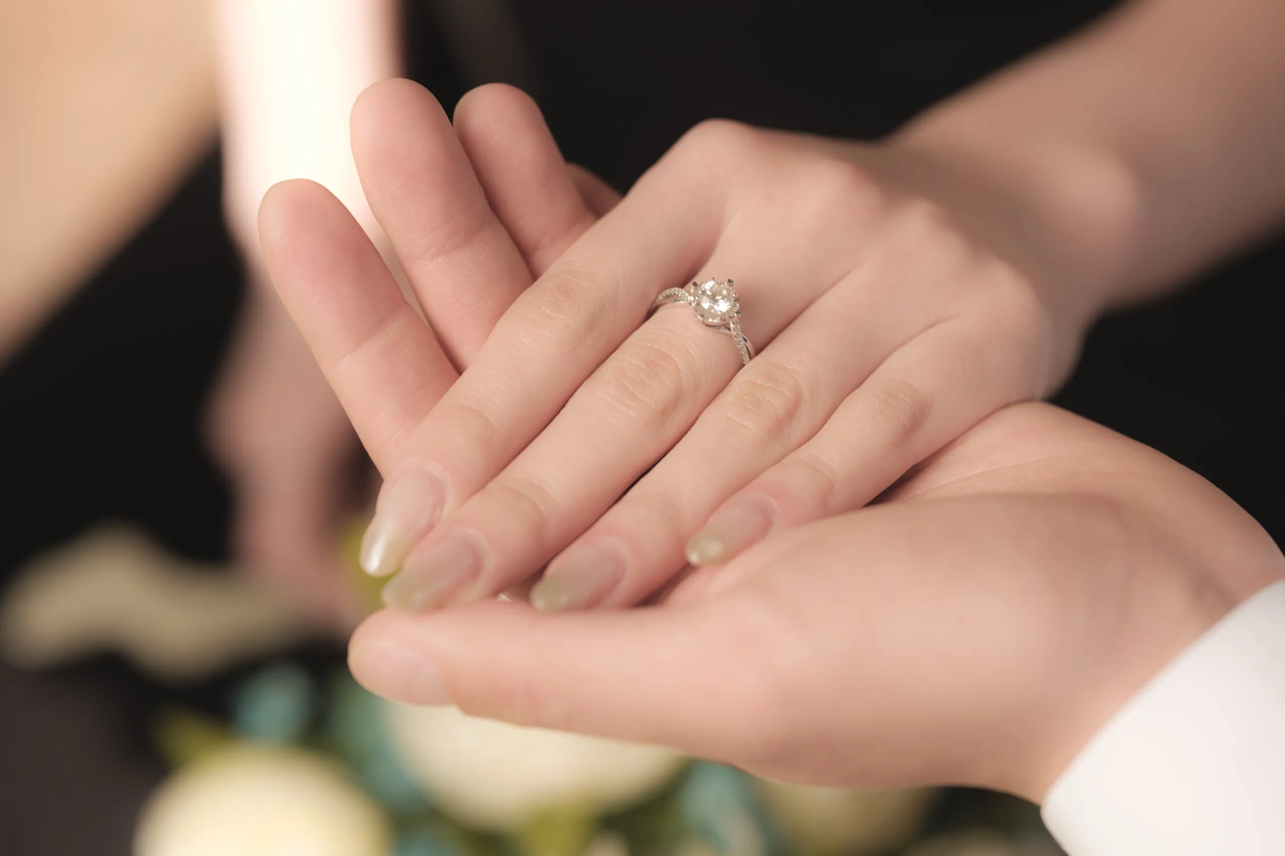 Close up of Josie's engagement ring as the couple's hands rest open in the sunlight, by AD Photography