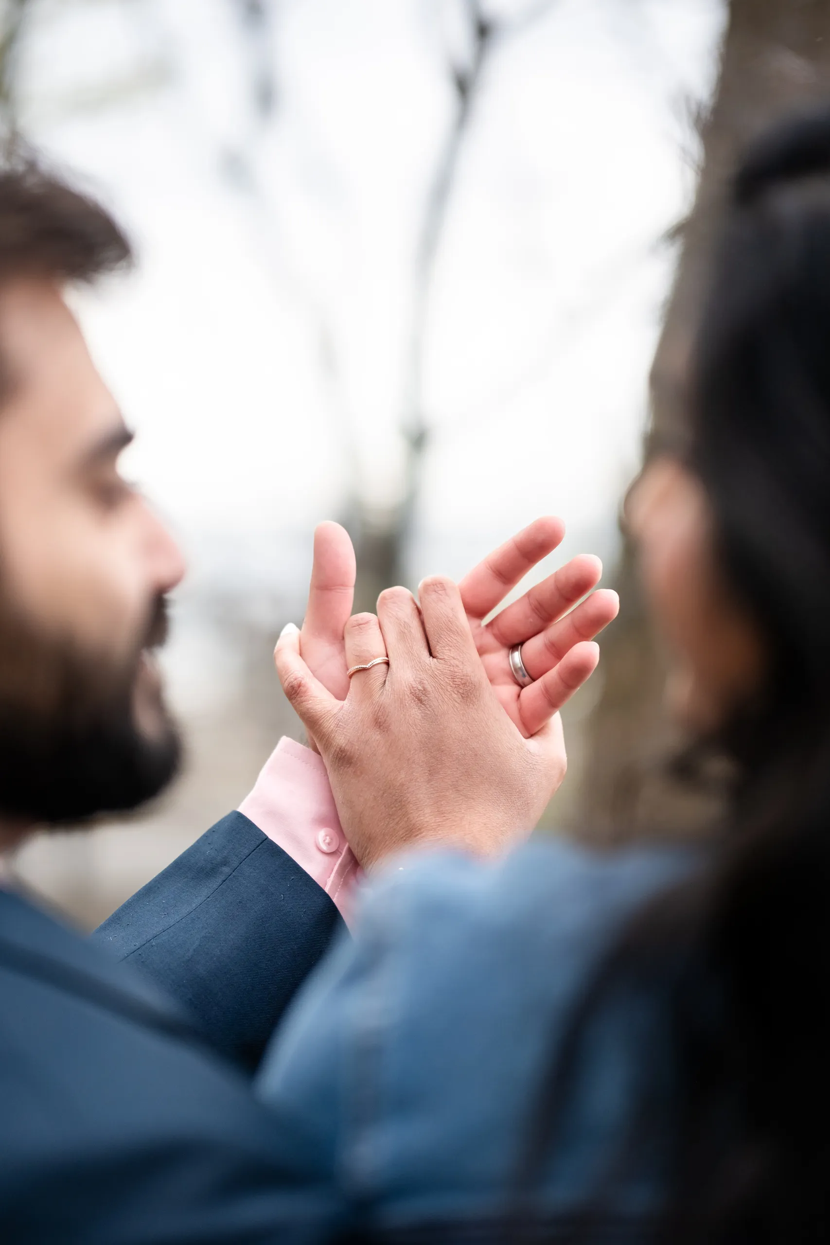 Abdullah and Nadia clasp hands showing both wedding rings at their Toronto civil ceremony, by AD Photography