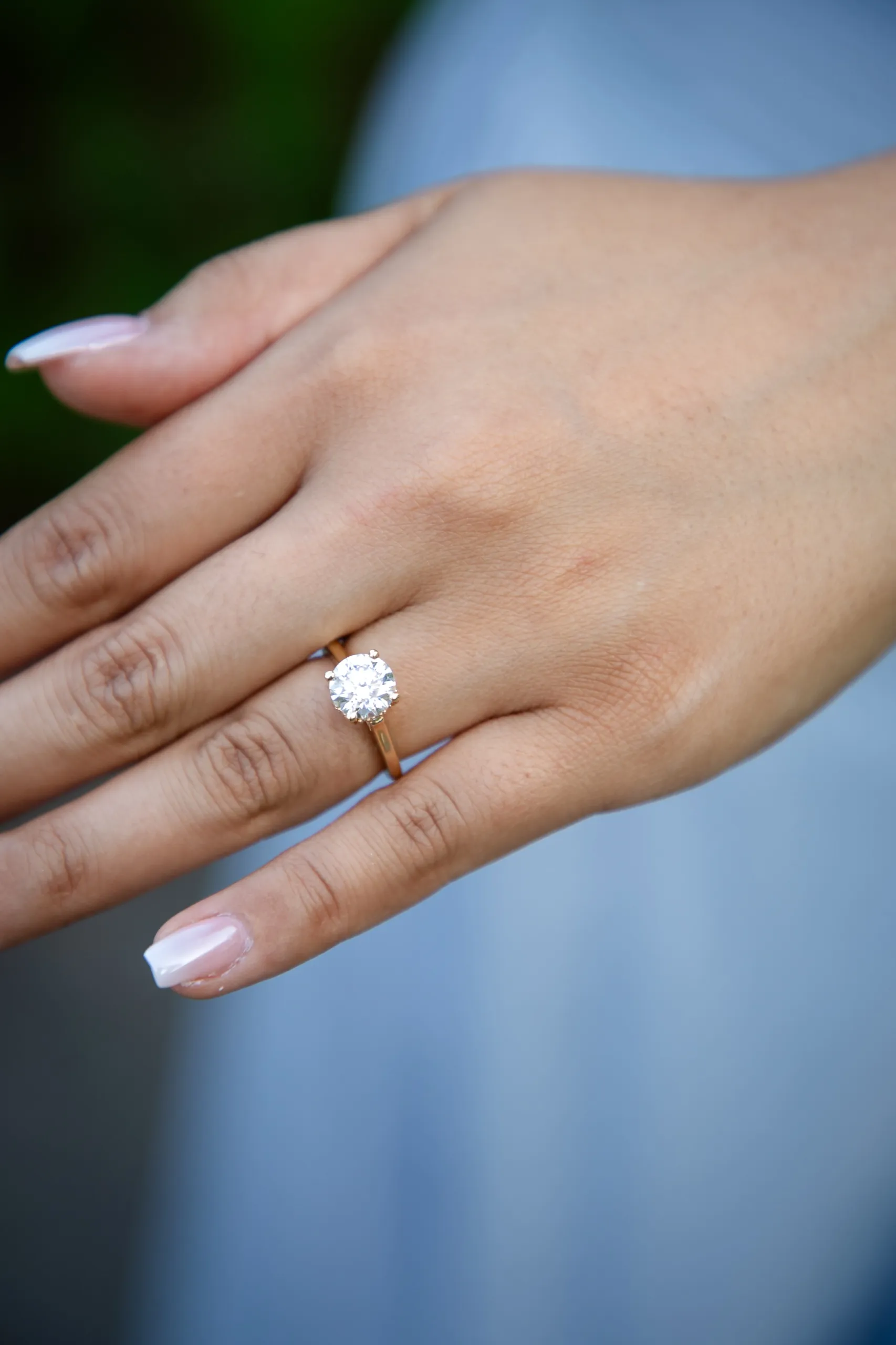 Close up of the engagement ring on Margarita's hand after the Toronto Music Garden proposal, by AD Photography