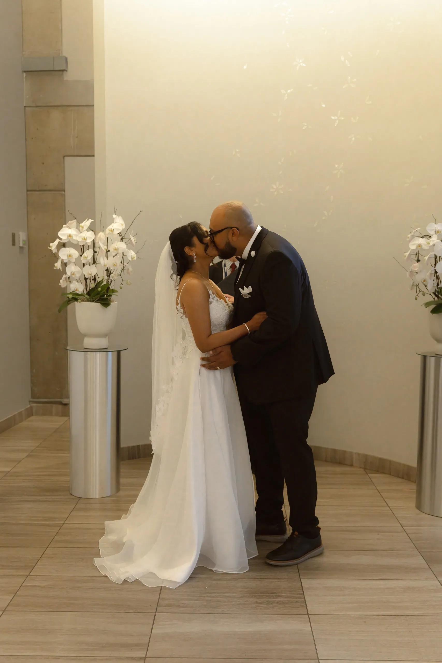 First kiss in the Toronto City Hall wedding chamber, by AD Photography