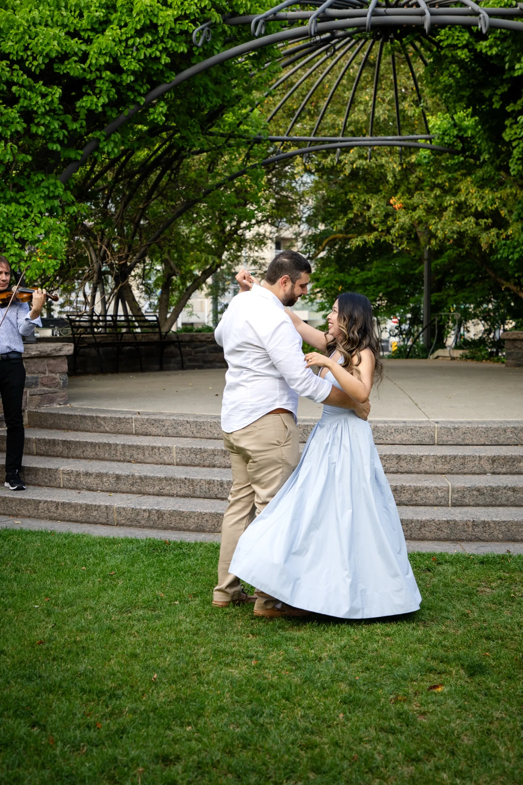 Margarita's dress catching the air as the couple dances to live violin at the Toronto Music Garden, by AD Photography
