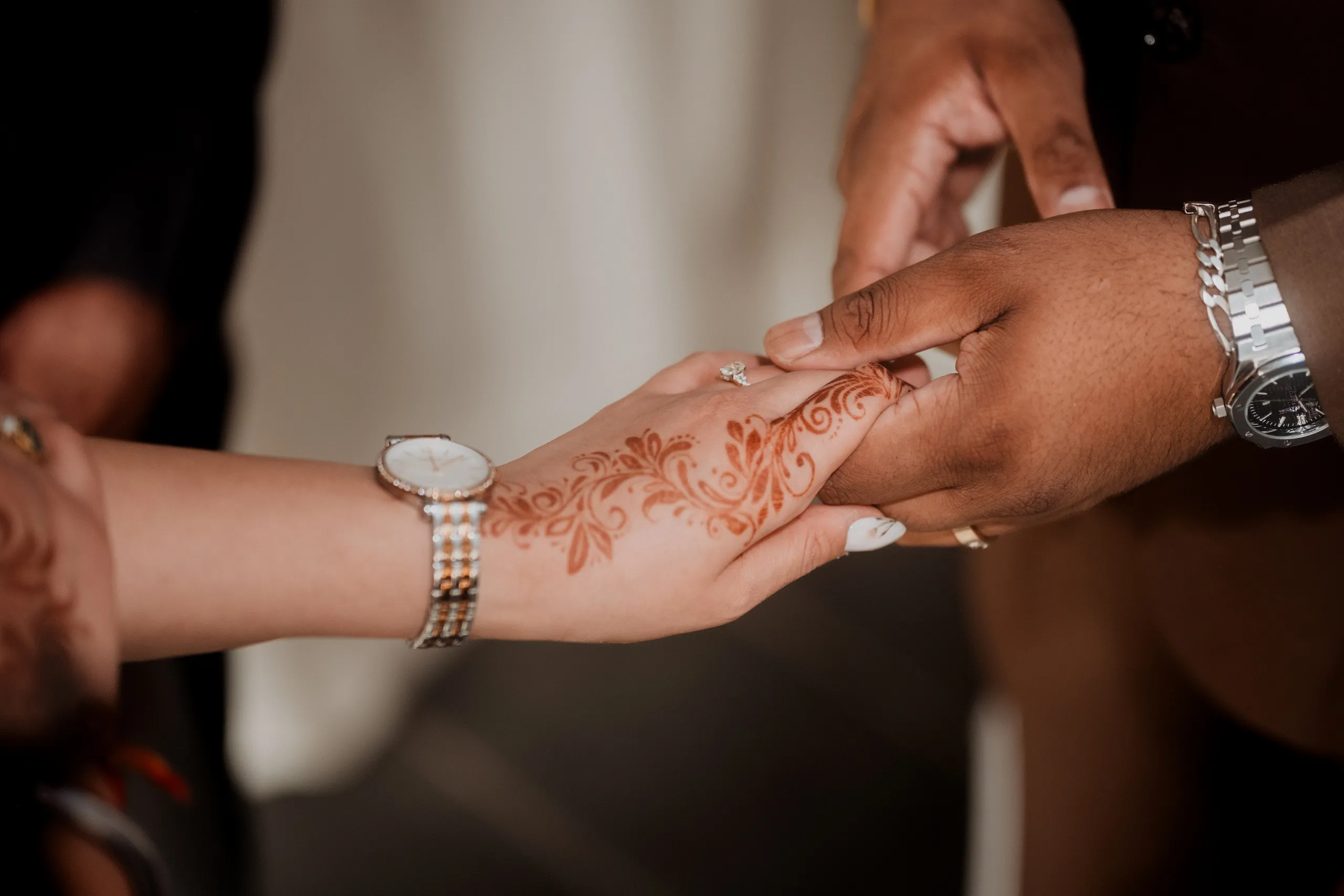 Close detail of joined hands at the civil ceremony, henna curling across Mehak's fingers, by AD Photography