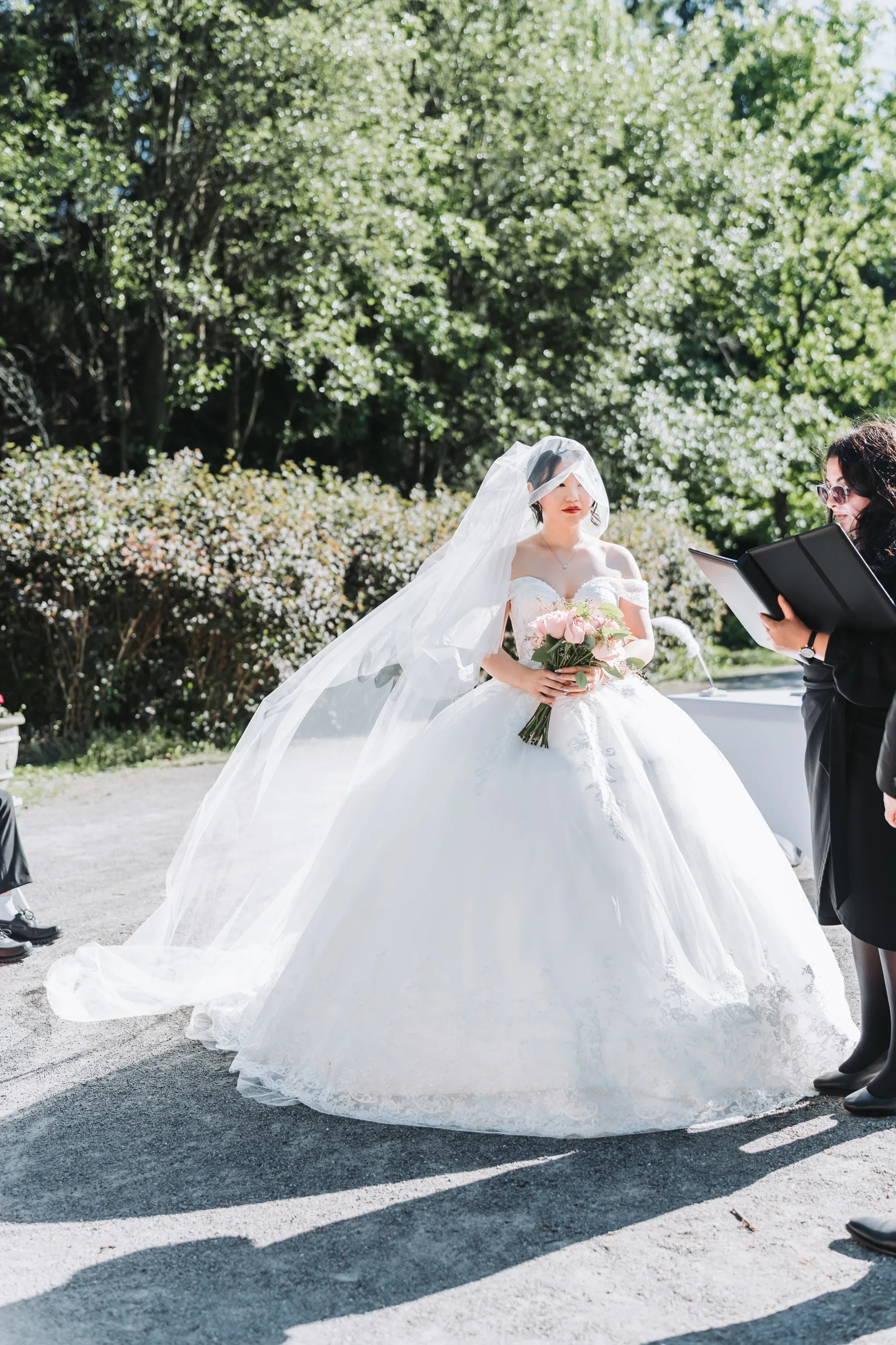 Karen's veil catching the wind at the altar during her Botanical Gardens ceremony in Niagara Falls, by AD Photography