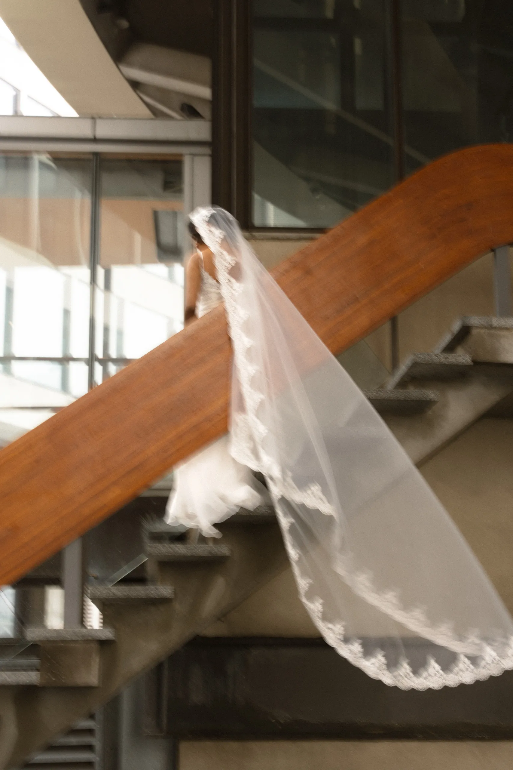 Cathedral veil trails over the wooden handrail on the City Hall stairs, by AD Photography