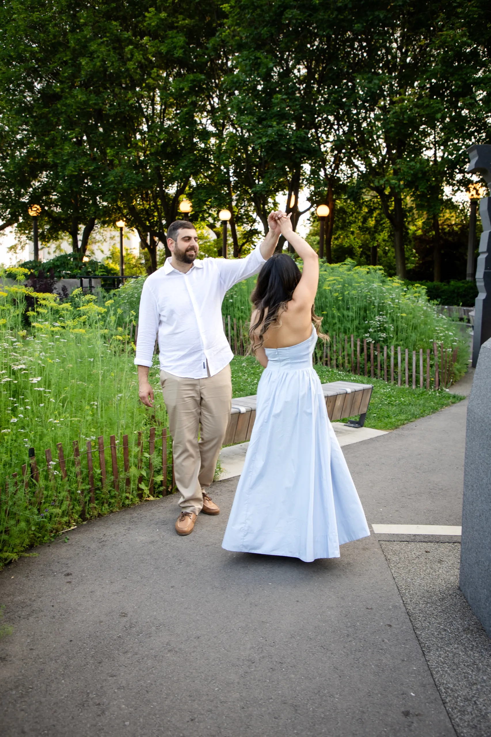 Mike twirling Margarita beside the wildflower beds at the Toronto Music Garden, by AD Photography
