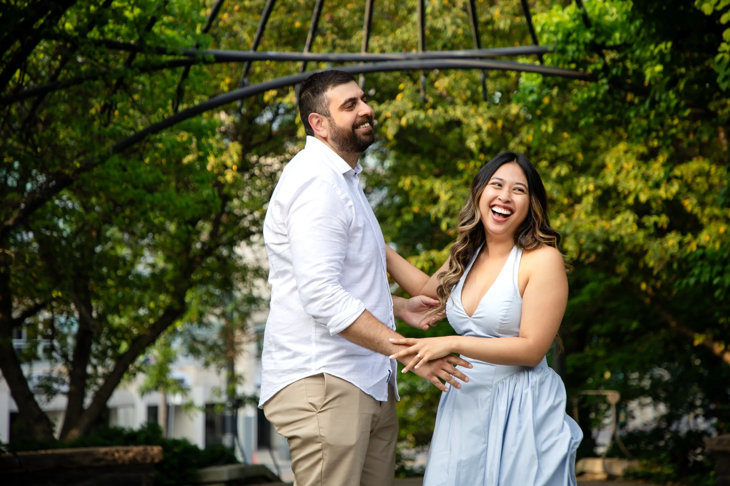 Margarita laughing with Mike on the lawn at the Toronto Music Garden in downtown Toronto, by AD Photography