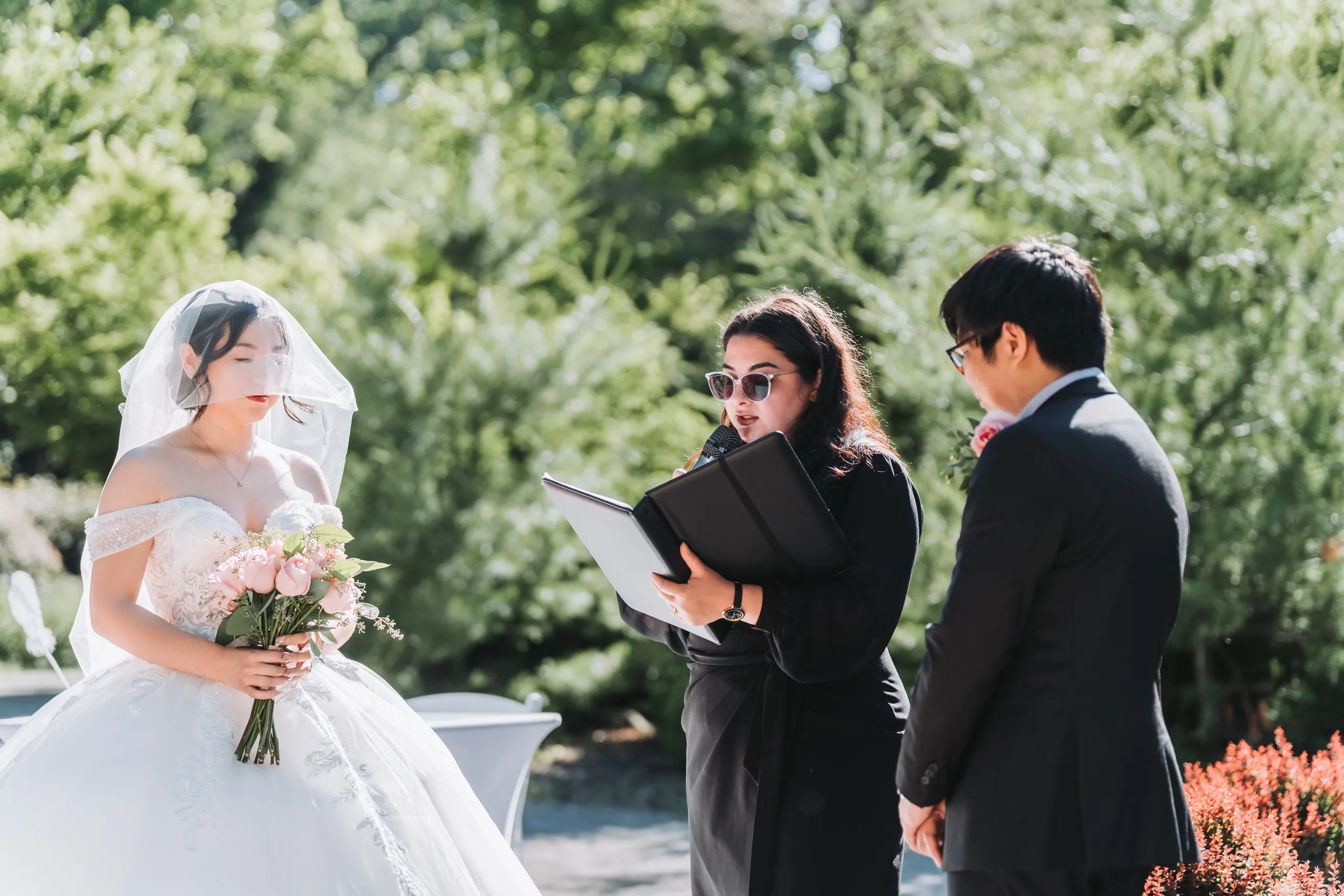 Micheal listening to the vows with the bridal bouquet soft in the foreground, Niagara Falls, by AD Photography