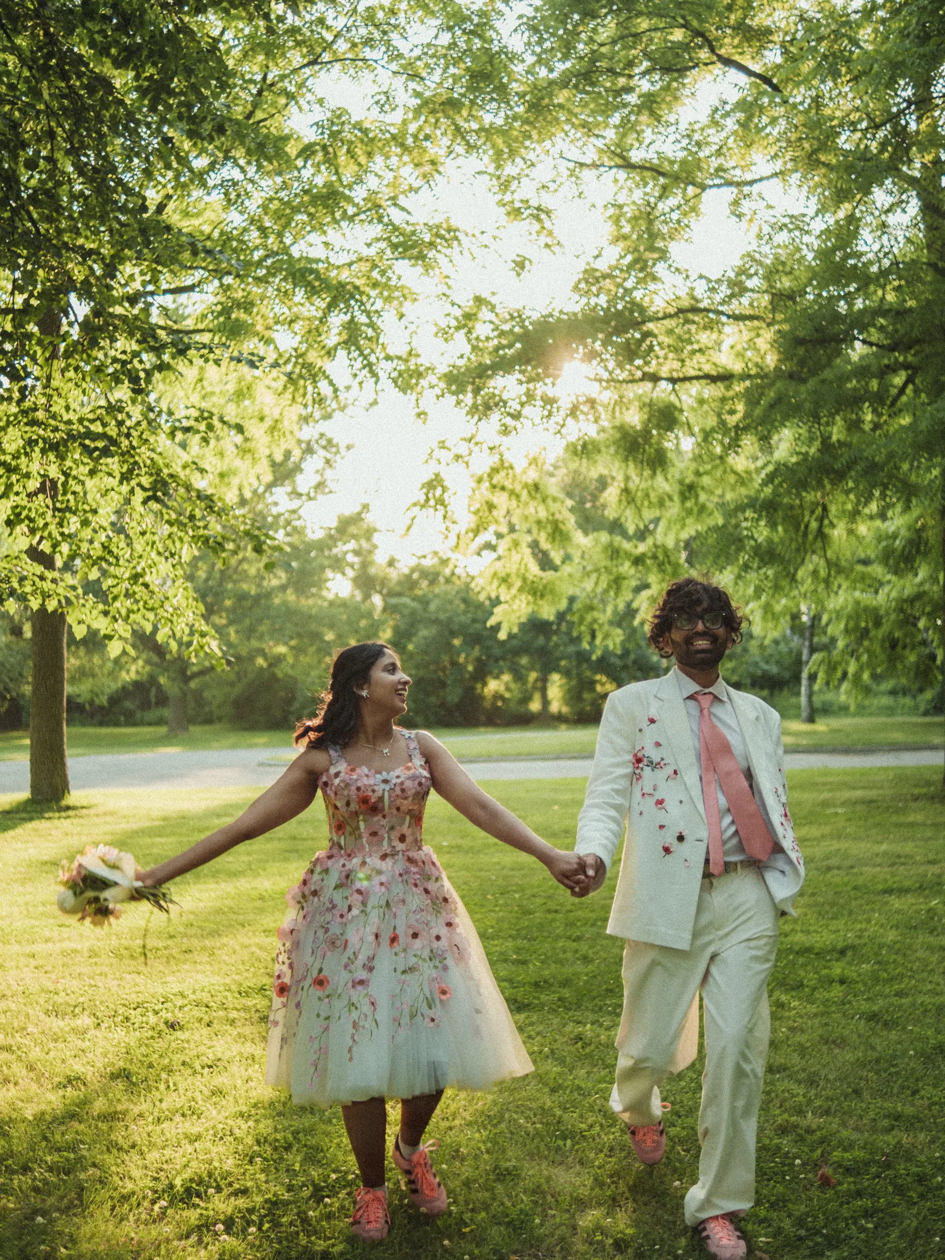 Payal glancing back mid stride and laughing under the tree canopy, Toronto Islands, by AD Photography