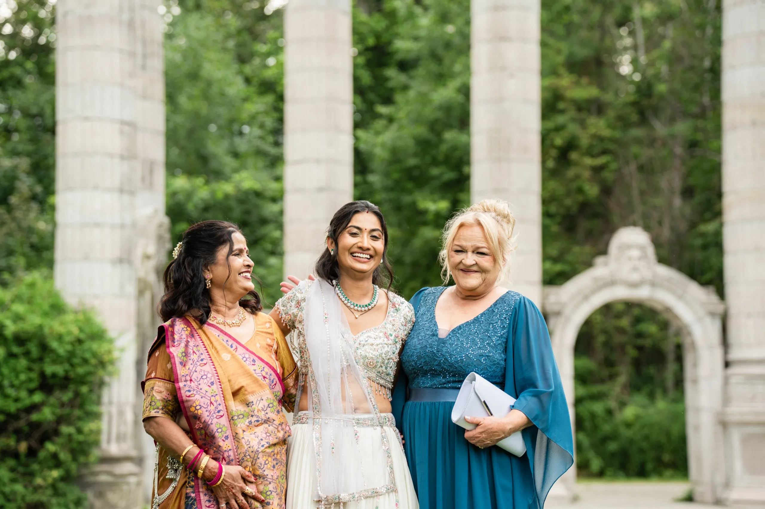 Nidhi laughs between her mother and her new mother in law, both women glowing., by AD Photography