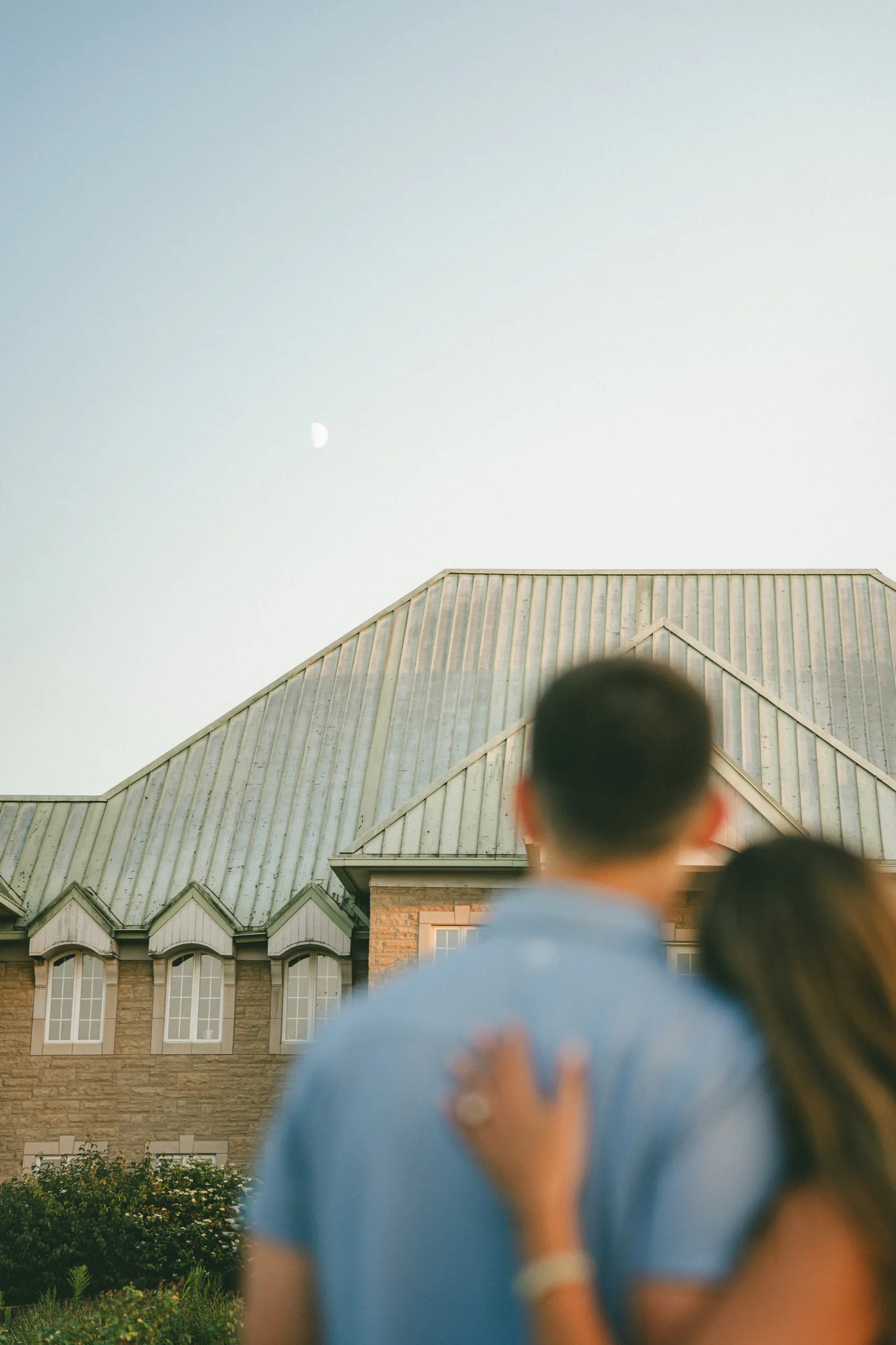 The moon and the château roof sharp behind Ashley and Donald, the two of them dissolved, by AD Photography