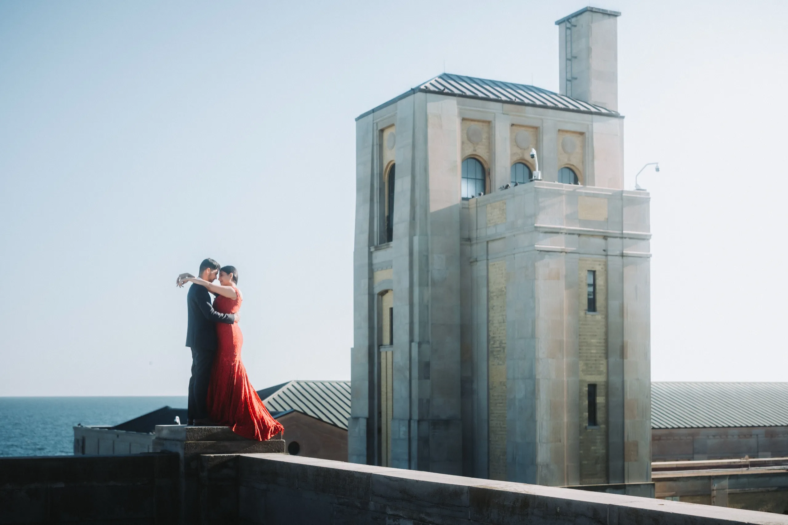 Lace train cascades off a stone plinth beside the art deco tower at R.C. Harris, by AD Photography