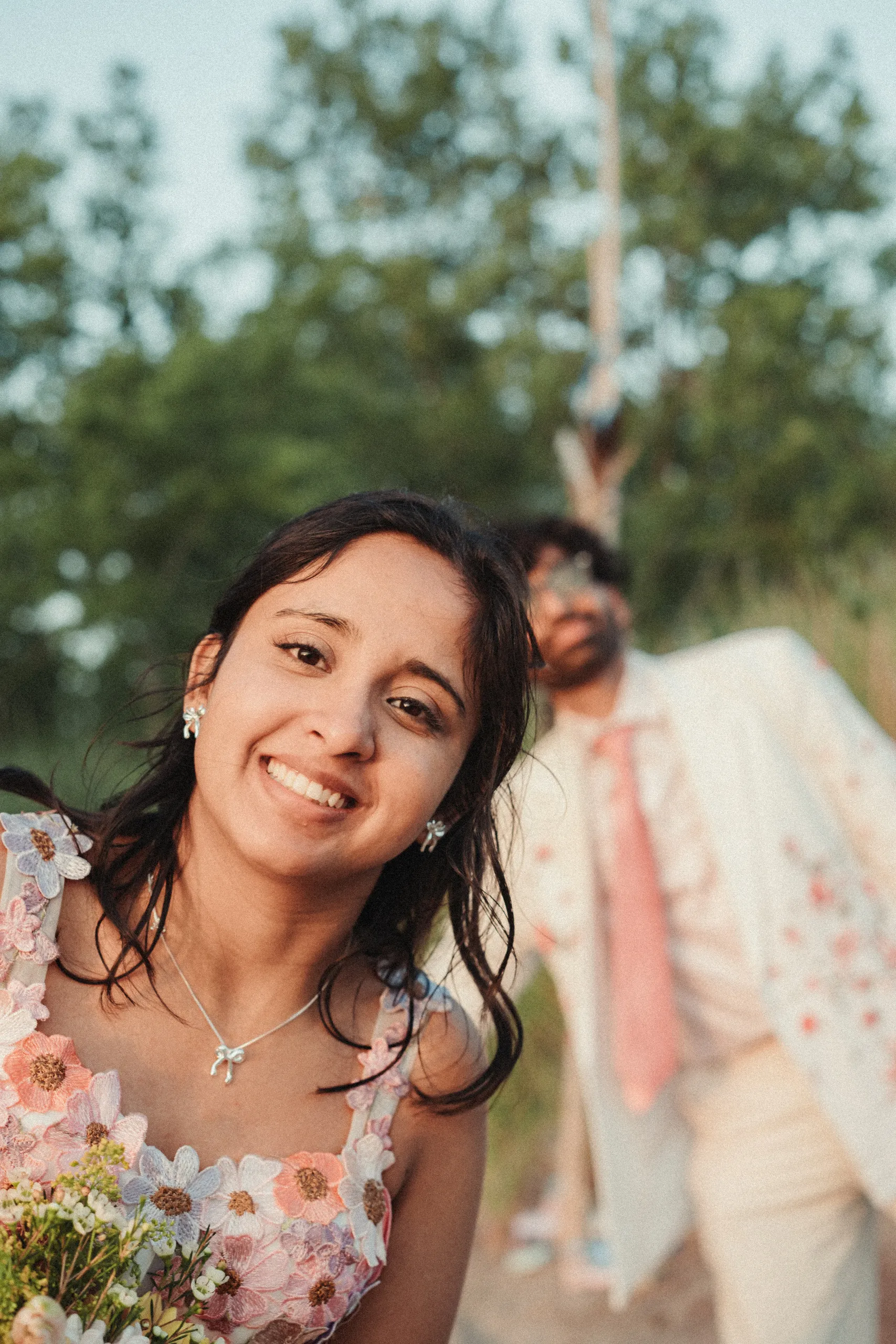 Payal sharp and radiant with Harsh soft behind her on the beach path, Toronto Islands, by AD Photography