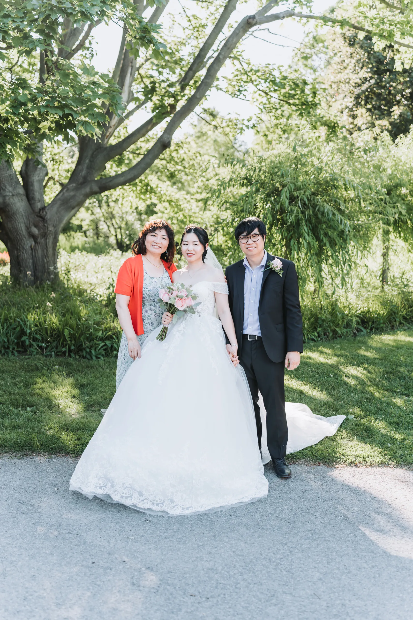 Karen and Micheal with the bride's mother on the garden path in Niagara Falls, by AD Photography