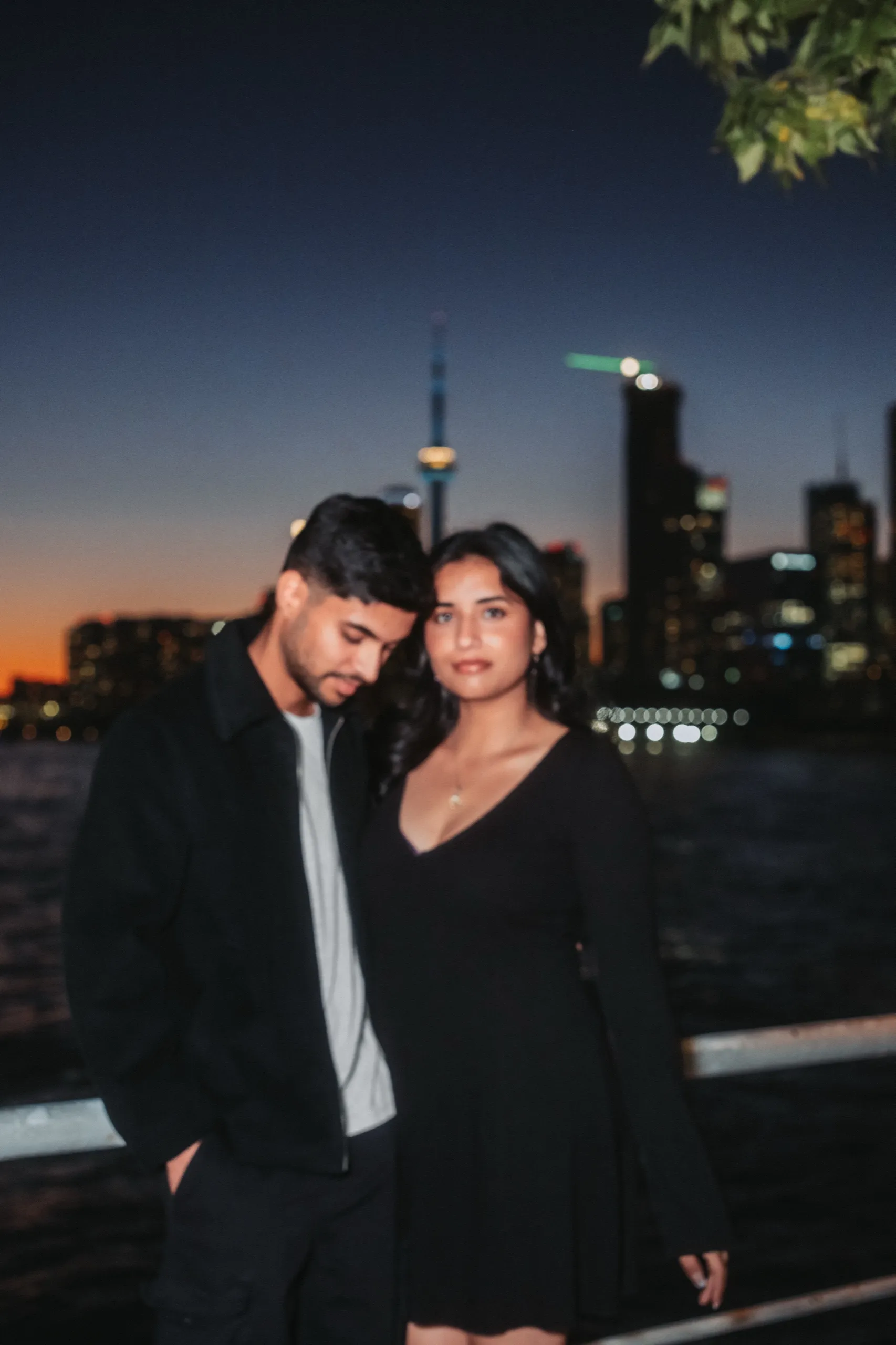 Direct flash portrait of the couple on the pier with the last of the sunset behind, by AD Photography