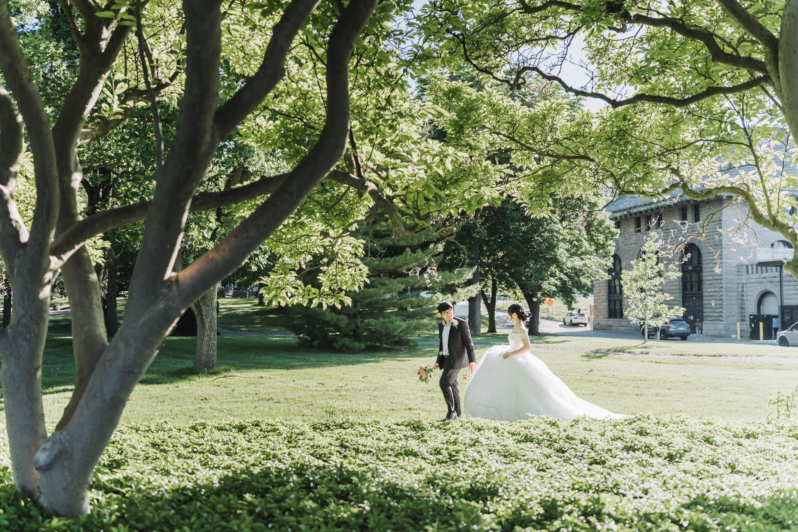 Karen and Micheal small beneath an enormous tree canopy at the Niagara Parks Botanical Gardens, by AD Photography