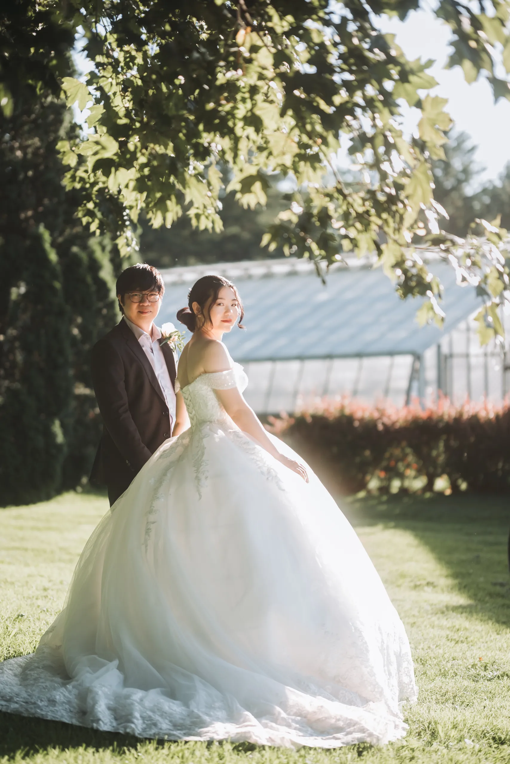 Karen and Micheal in warm sun flare in front of the Botanical Gardens greenhouse, Niagara Falls, by AD Photography