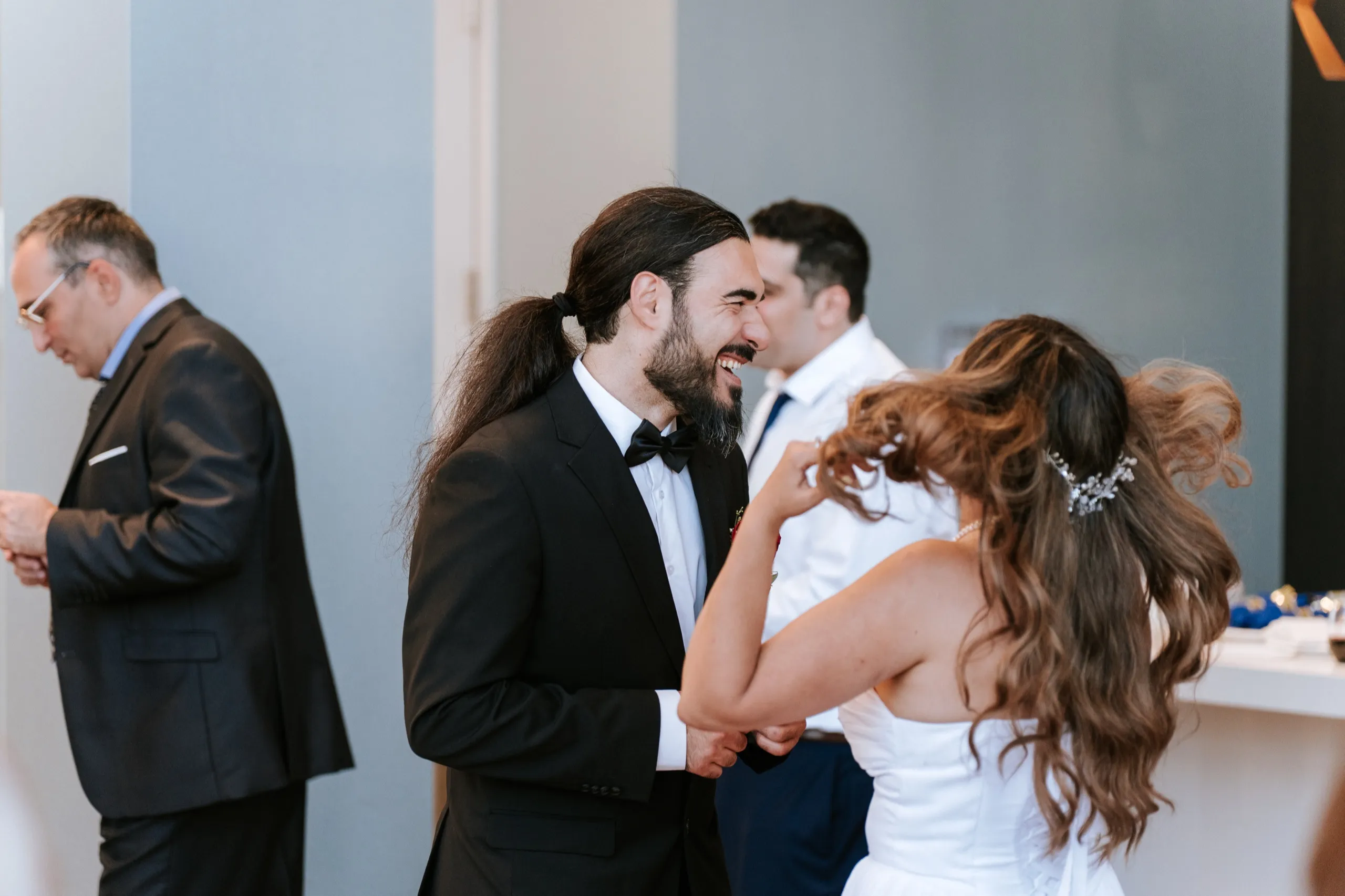 Moe laughing face to face with Zoha, the two of them blurred mid dance, by AD Photography