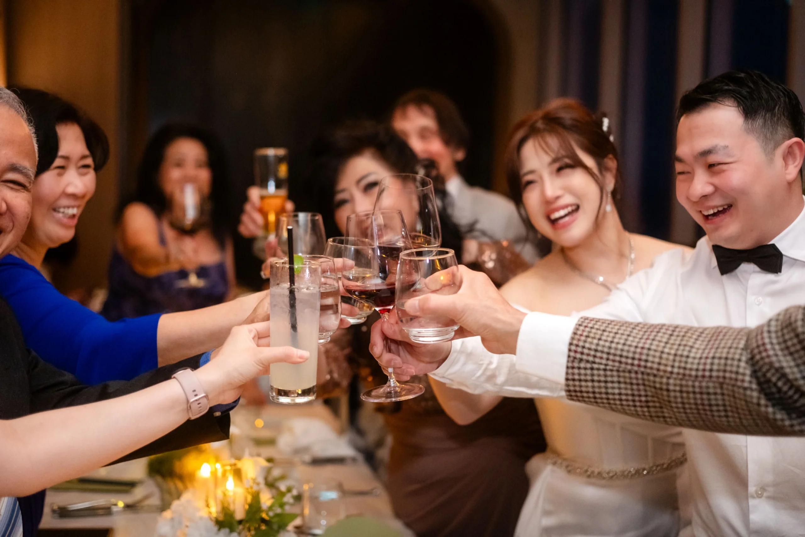 Toronto wedding photography at Aera, Grace and Giovanni cheers close up with family